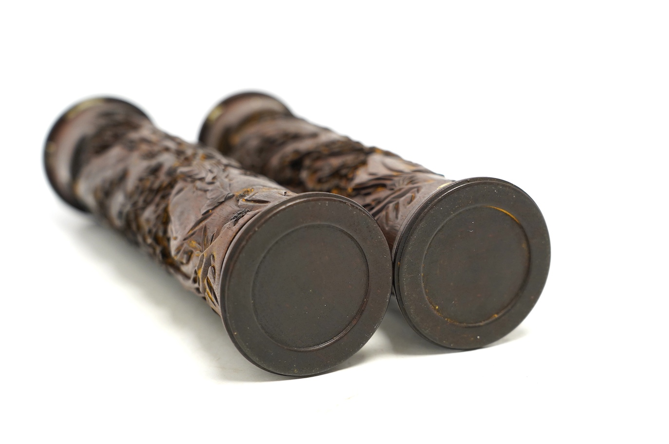 A pair of Chinese hardwood incense holders carved with trees and figures, cased, 29cm high. Condition - good